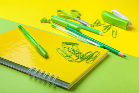 Set of school stationery on color background