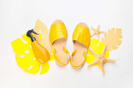 Composition with beach accessories on white background