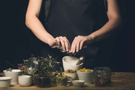 Female alchemist making elixir in laboratoryの写真素材