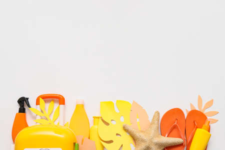 Composition with beach accessories on white background