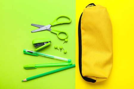 Set of school stationery on color background