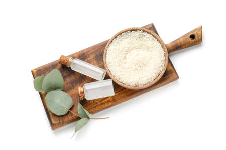 Bottles of rice water on white background