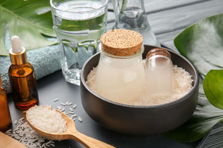 Composition with healthy rice water on tableの写真素材
