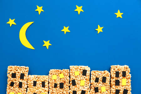 Composition with crispy rice bars on color background