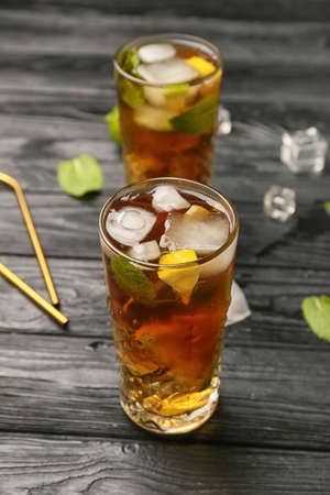 Glasses of tasty Cuba Libre cocktail on tableの写真素材