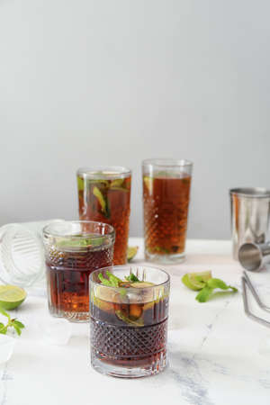 Glasses of tasty Cuba Libre cocktail on tableの写真素材