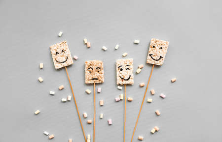 Composition with crispy rice bars on gray background