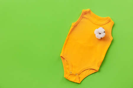 Cotton baby clothes on color backgroundの写真素材