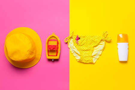 Flat lay composition with child beach accessories on color background. Travel conceptの写真素材