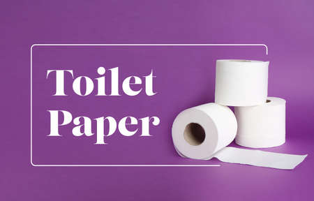 Rolls of soft toilet paper on color backgroundの写真素材