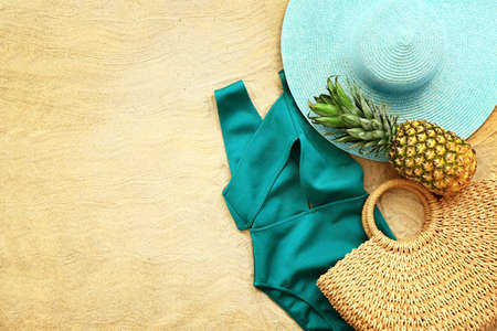 Beach accessories on sand backgroundの写真素材