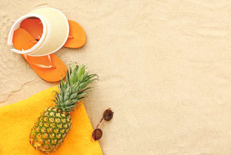 Beach accessories on sand backgroundの写真素材