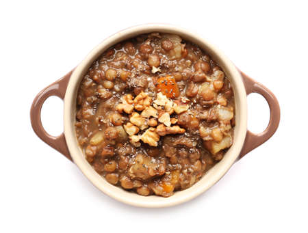 Pot of tasty lentils soup on white backgroundの写真素材