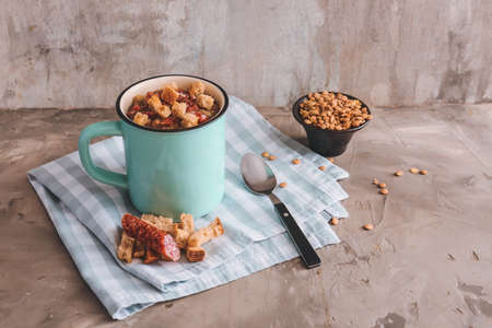 Cup of tasty lentils soup on grunge backgroundの写真素材