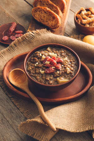 Bowl of tasty lentils soup on tableの写真素材