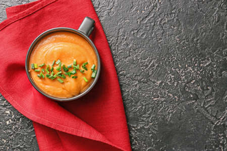 Cup of tasty lentils soup on dark backgroundの写真素材