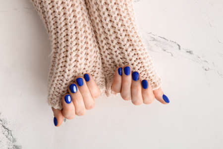 Hands with beautiful manicure on white backgroundの写真素材