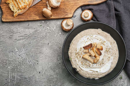 Bowl of tasty cream soup on dark backgroundの写真素材