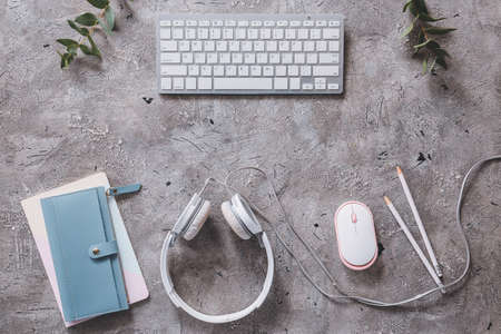 Composition with keyboard, headphones, PC mouse and stationery on grunge backgroundの写真素材
