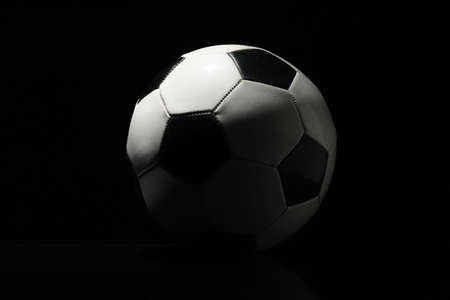 Soccer ball on dark backgroundの写真素材