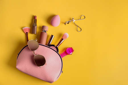 Composition with cosmetic bag on color backgroundの写真素材