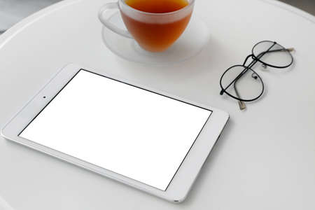 Modern tablet computer on white tableの写真素材