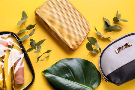 Composition with cosmetic bags on color backgroundの写真素材