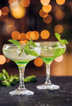 Glasses of fresh martini on tableの写真素材