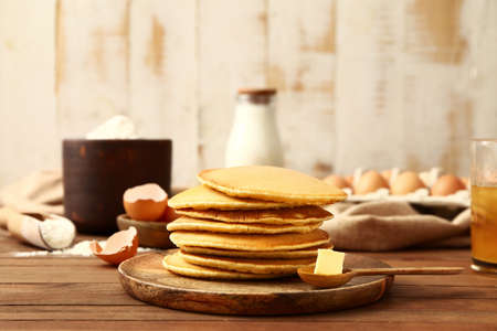Plate with tasty pancakes on tableの写真素材