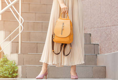 Young woman with stylish bag near shop outdoorsの写真素材