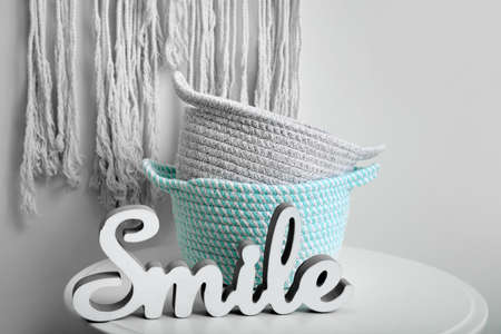 Wicker baskets on table in roomの写真素材