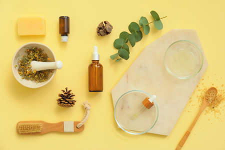 Composition of bottles with natural cosmetics on color backgroundの写真素材