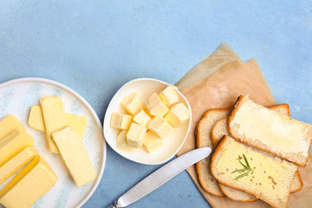 Plate with tasty fresh butter on color backgroundの写真素材