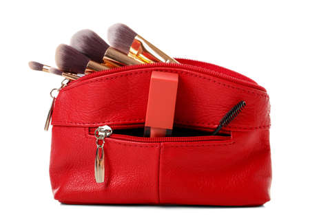 Set of makeup brushes in cosmetic bag on white backgroundの写真素材