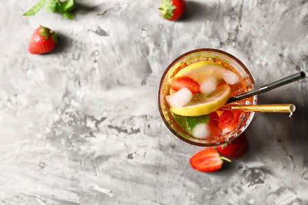 Glass of tasty strawberry mojito on grunge backgroundの写真素材