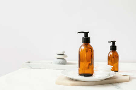 Bottles of different cosmetics on tableの写真素材