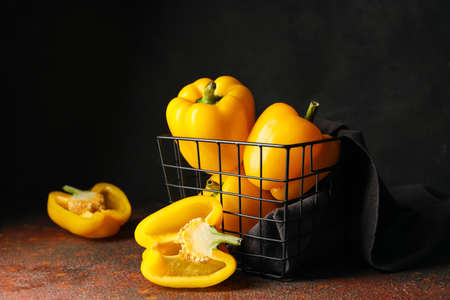 Yellow bell pepper in basket on table