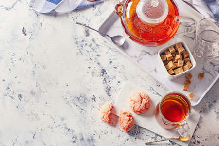 Composition with hot tea on table