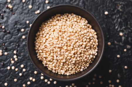 Bowl with healthy quinoa on dark backgroundの写真素材