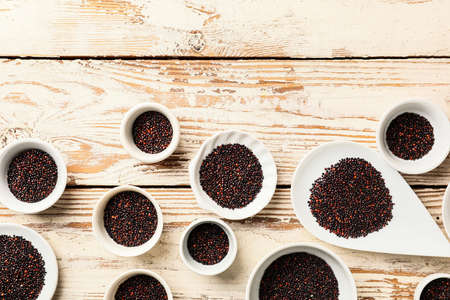 Bowls with healthy quinoa on tableの写真素材
