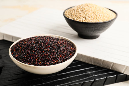 Bowls with healthy quinoa on tableの写真素材