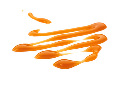 Liquid caramel on white backgroundの写真素材