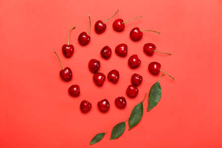 Ripe sweet cherry on color background