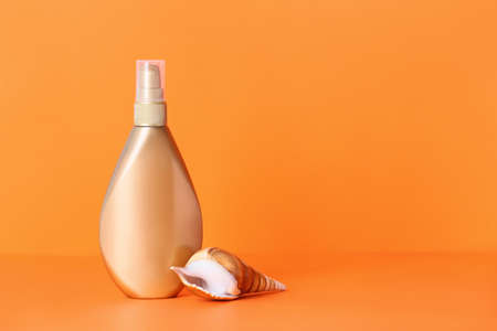 Bottle of sunscreen on color backgroundの写真素材