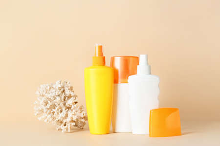 Bottles of sunscreen on color backgroundの写真素材