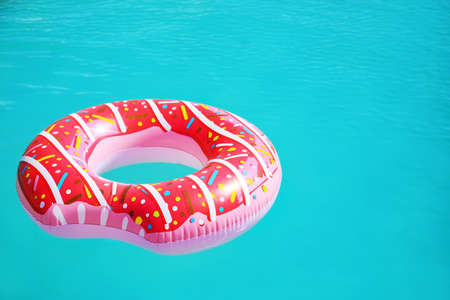 Inflatable ring in swimming poolの写真素材