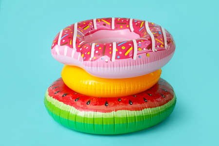 Inflatable rings on color background
