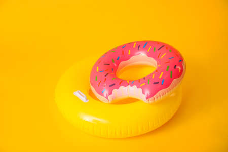 Inflatable rings on color backgroundの写真素材