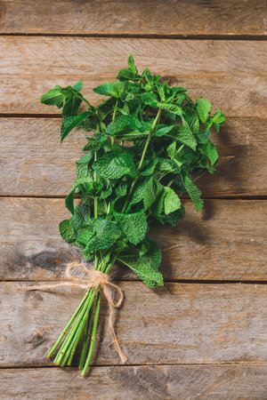Fresh green mint on wooden backgroundの写真素材