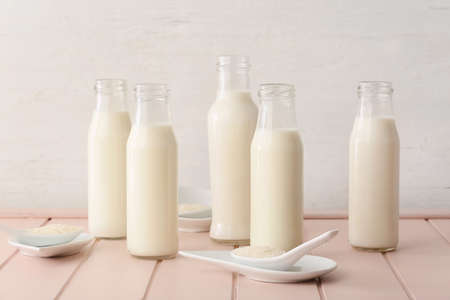 Bottles of rice milk on tableの写真素材